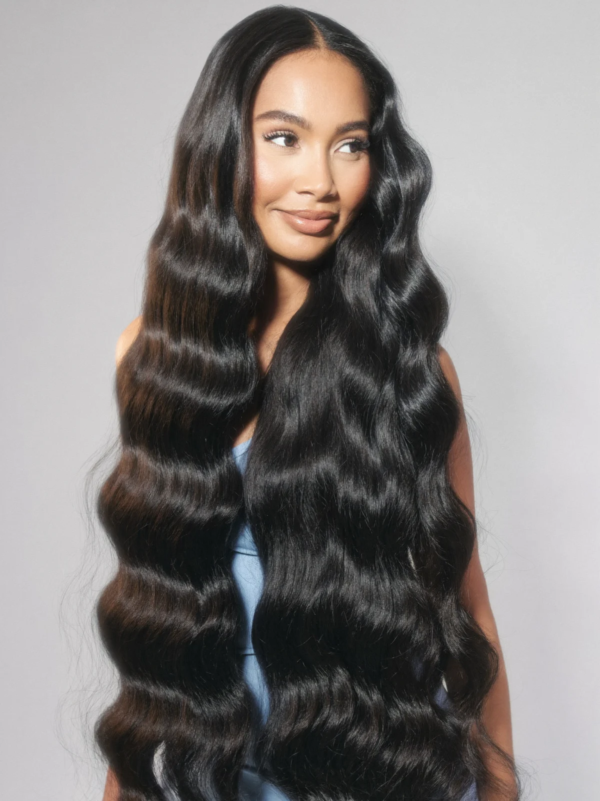 Model with long jet black body wave hair