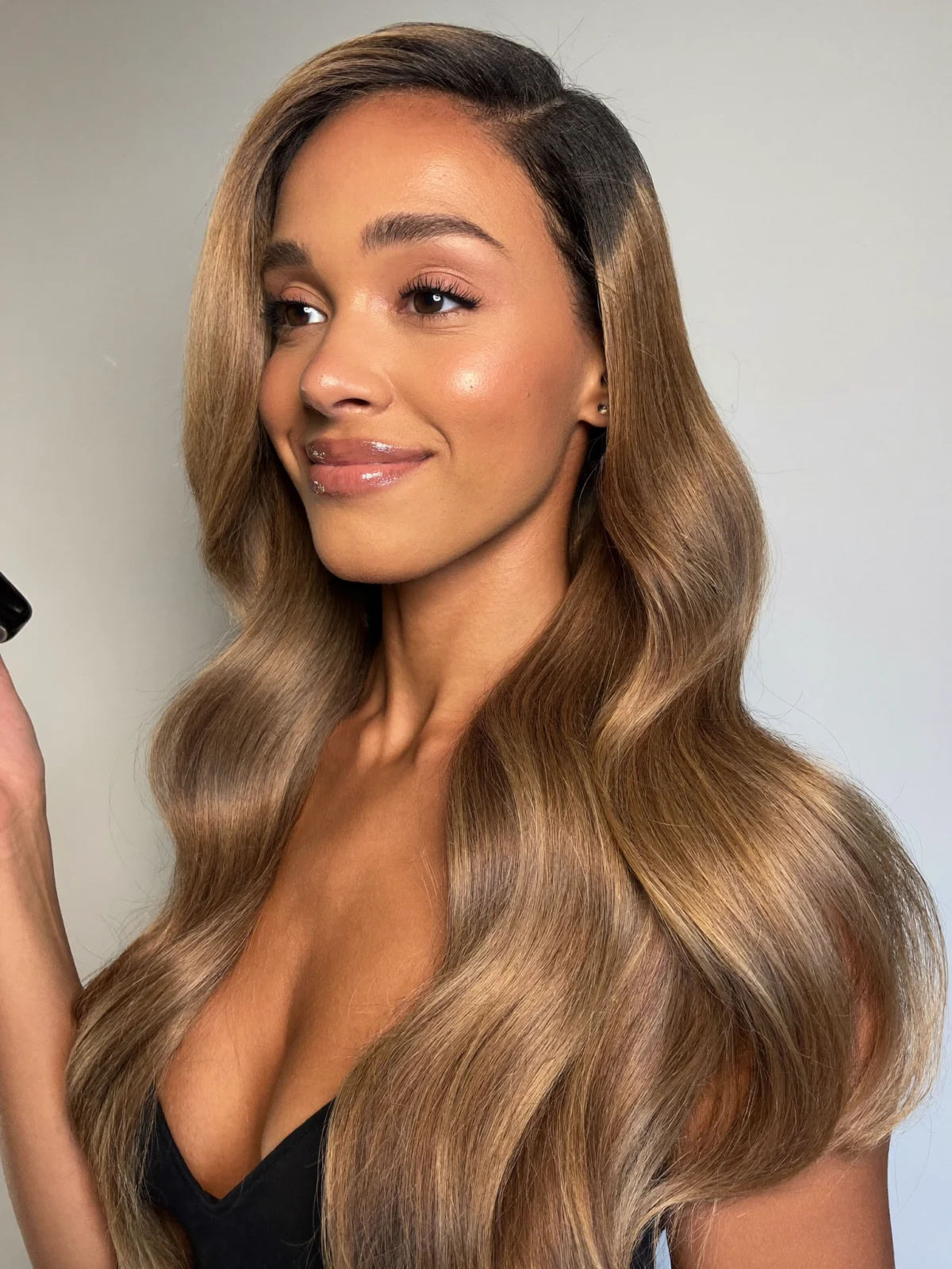 Model wearing a honey balayage body wave wig